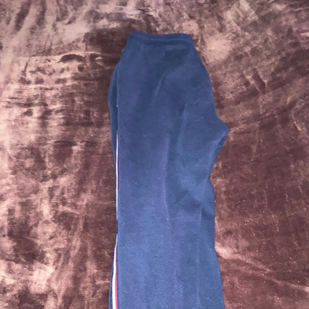 Navy blue pants with red & white stripes on the side